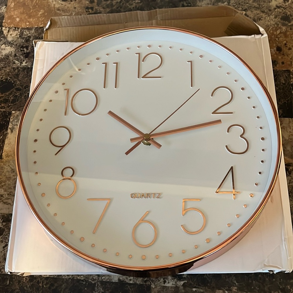 Beautiful 12” round Long DeLi wall clock in pinkish metallic trim
